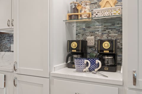 Cozy coffee bar w/two drip coffee makers, mugs and all essentials