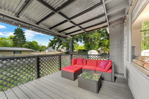 Relax and unwind in the green backyard, with a comfortable sitting area