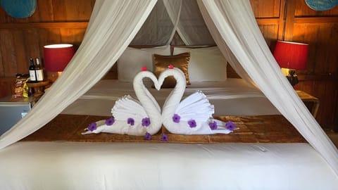 Family Bungalow, 2 Bedrooms, Mountain View | Minibar, individually decorated, desk, laptop workspace