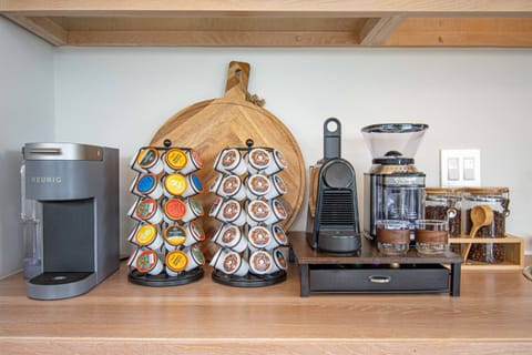 Coffee Station: Brew your perfect cup with a variety of pods and stylish equipment at your fingertips!