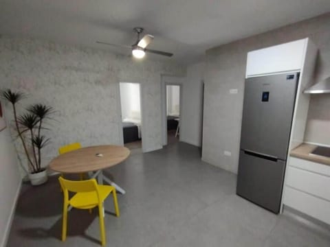 Family Apartment, Balcony | Private kitchen | Shared fridge, microwave, cookware/dishes/utensils, cleaning supplies