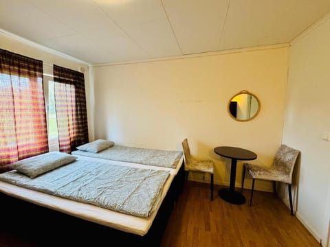 Desk, laptop workspace, bed sheets