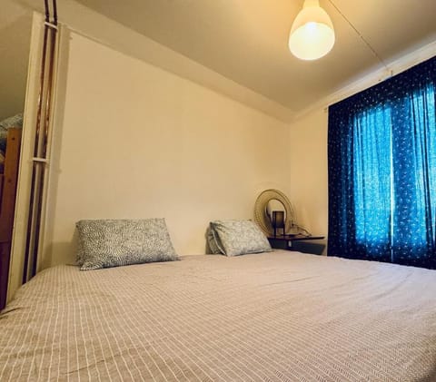 Desk, laptop workspace, bed sheets