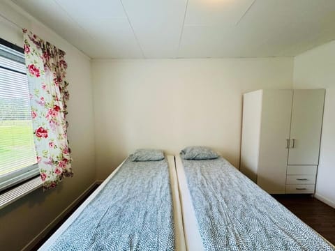 Desk, laptop workspace, bed sheets