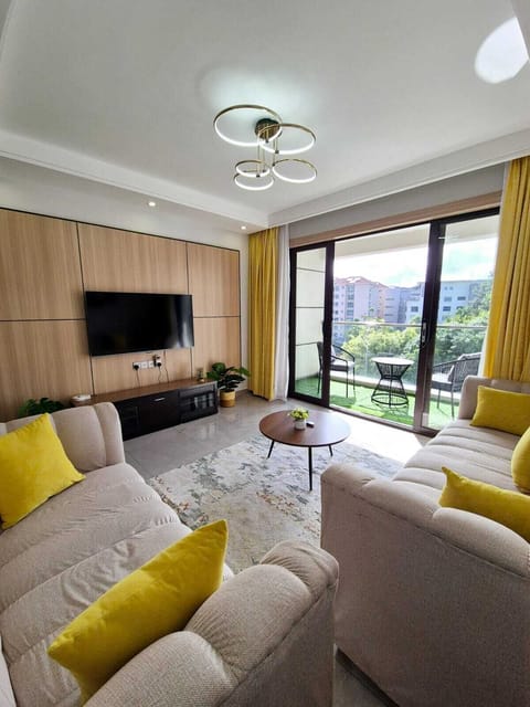 Executive Apartment, Balcony, City View | Living area | 32-inch Smart TV with digital channels