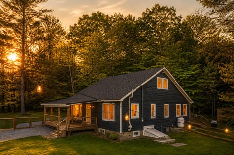 Watch the sunset through the trees from the wraparound deck as the string lights come on. It's an easy spot to sit outside as the evening winds down.
