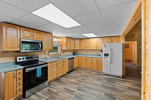 With cabinets galore and plenty of room to move, this fully equipped kitchen is ready for any group meal—from pancake breakfasts to hearty home-cooked dinners.