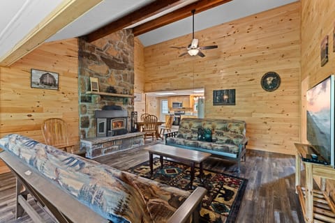 From morning coffee to evening game time, this open-concept living area blends comfort, warmth, and togetherness in one inviting space.