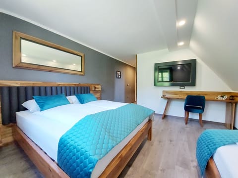 Deluxe Triple Room, Garden View | In-room safe, free WiFi