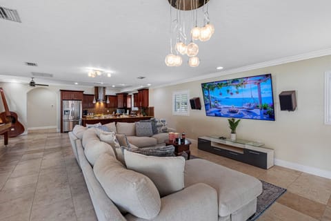 This welcoming space features a spacious, plush sectional sofa, perfect for stretching out and relaxing after a day of exploring, swimming, or sightseeing.