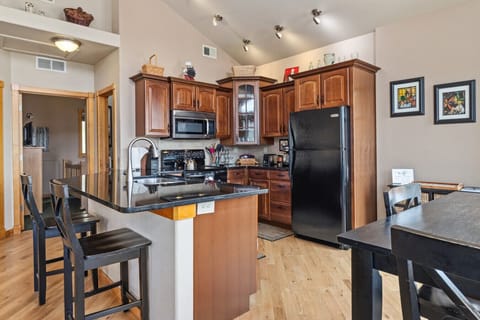 Kitchen comes fully stocked with cooking essentials like pots, pans, kettle and toaster.