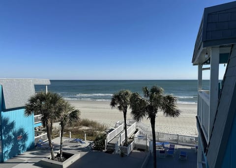 Photo from condo balcony of the beach and pool deck