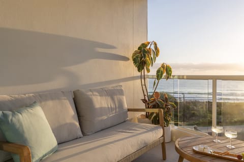 Relax into a comfy coastal lounge with sparkling ocean views.