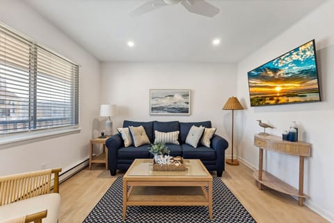 Comfortable living space with seating and a TV.
