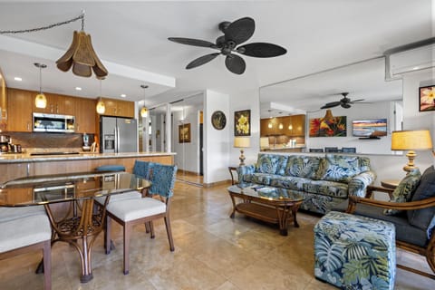 Relax in your tropical retreat where island-style furnishings meet modern comfort. The open layout connects the fully-equipped kitchen to your spacious living area, perfect for unwinding after a day of adventure.