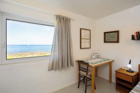 Desk and Bedroom Corner – Workstation with natural light.

