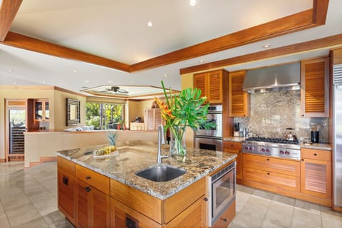 Gourmet kitchen with granite counters, premium appliances, and a generous island—perfect for entertaining or chef-prepared meals.