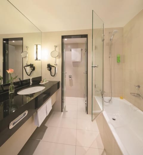 Family Room, 2 Queen Beds | Bathroom | Eco-friendly toiletries, hair dryer, towels