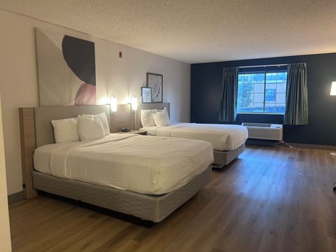 Standard Room, 2 Queen Beds, Non Smoking | Desk, laptop workspace, blackout drapes, iron/ironing board