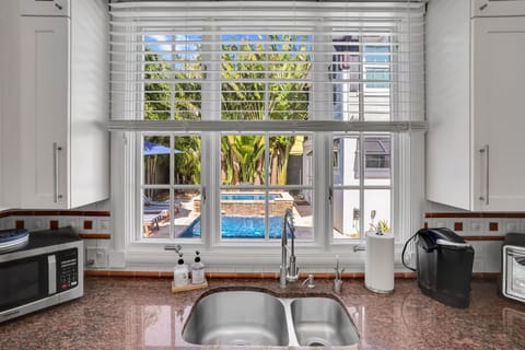 House #1 - Full Kitchen looks out to the pool/spa