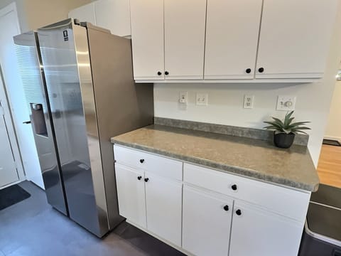 Our kitchen includes: Electric stove, microwave, fridge/freezer and prep space.