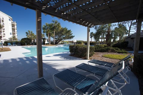 Surrounded by landscaped grounds and comfortable lounge seating, this inviting pool area feels private and relaxed.