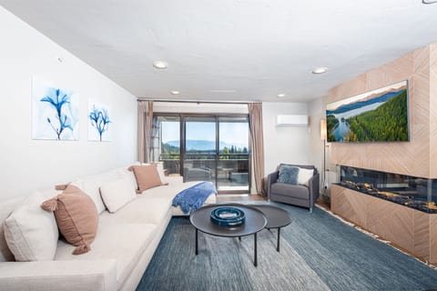 Relax after a day of adventure in the cozy living space with a gas fireplace at Eidelweiss 214 | Main Level