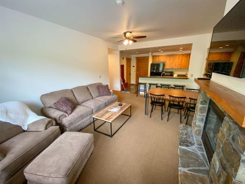 The open concept kitchen, living room & dining area provide a great gathering space for your whole group | Main Level