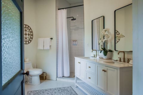 Luxury Suite, Garden View | Bathroom | Shower, hair dryer, towels, soap