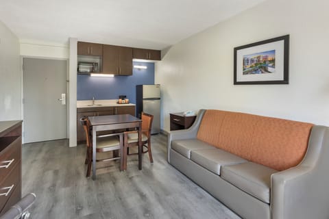 Suite, 1 King Bed | Desk, blackout drapes, iron/ironing board, free WiFi