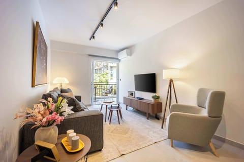 Bright interiors, tasteful decor, and balcony connection create a stylish retreat steps from vibrant city life