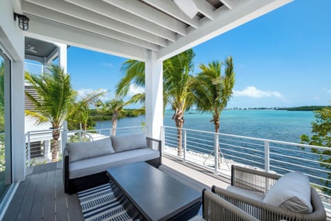 Private oceanfront balcony with sweeping turquoise water views