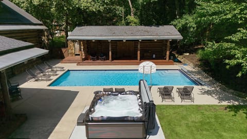 Outdoor oasis with private pool, cozy cabin feel, and nature all around.