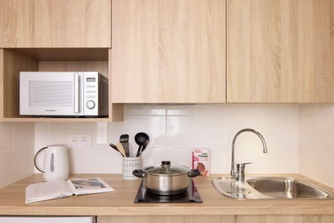 Mini-fridge, microwave, stovetop, coffee/tea maker