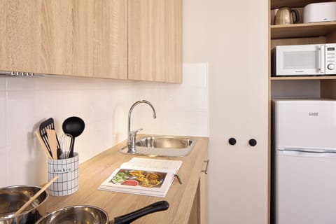 Mini-fridge, microwave, stovetop, coffee/tea maker