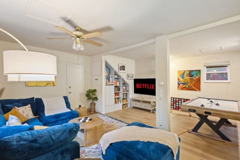 Bright open living and game room. Cloud comfort sofa, 64 inch TV with your streaming perfect for movie nights. Air hockey and games for all ages. 