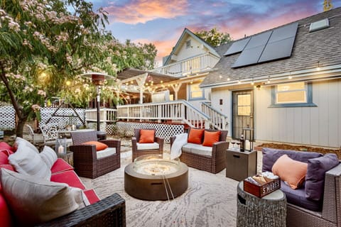 Glowing fire pit with dinning area- perfect for friends & family gathering under the stars. Seating for 10. 