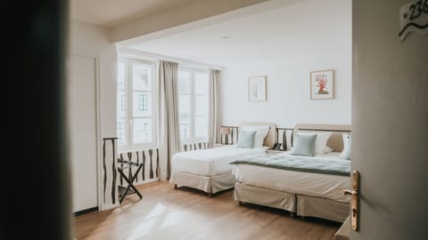 Standard Triple Room | Blackout drapes, iron/ironing board, free cribs/infant beds, free WiFi