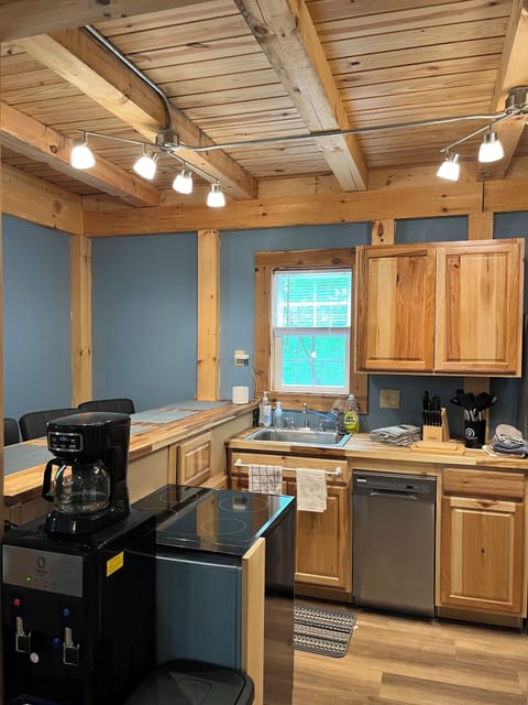 Fully outfitted kitchen includes water cooler and coffee service.