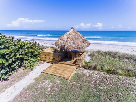 The tiki hut in our back yard gets you right out onto the sand!