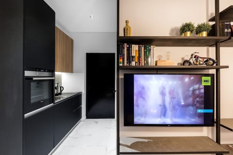 Integrated entertainment wall offers cozy movie nights after discovering the lively surrounding neighborhood.