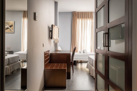 Family Room | Memory foam beds, minibar, in-room safe, desk