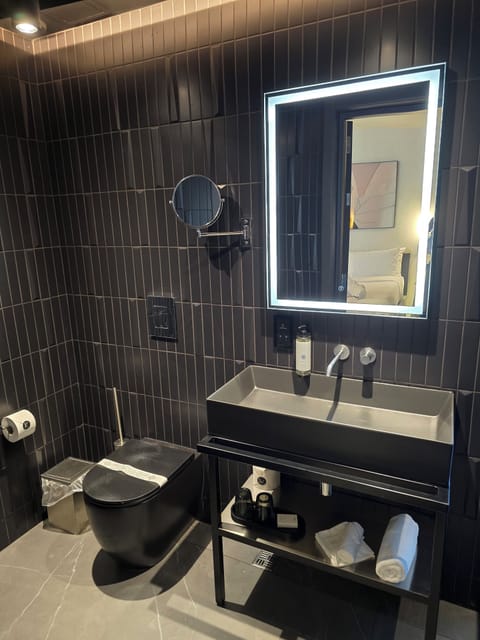 Designer toiletries, hair dryer, bathrobes, slippers