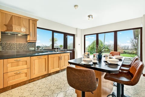 Fully equipped kitchen with garden views