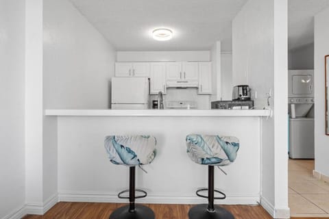 Featuring open bar seating, this kitchen is perfect for casual dining or keeping company while you cook.