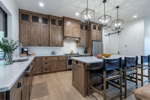Open concept kitchen with stainless steel appliances and granite countertops