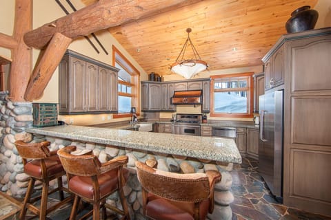 The modern rustic kitchen is fully equipped with all you need to create memorable meals together | Main Level