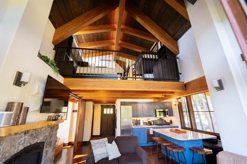 The stunning lofted ceiling and custom architecture beautifully frame the living space | Main Level