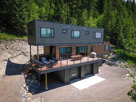The homes wrap around patio offers private hot tub, grill & dining area, and cozy seating to relax and take in the views | Exterior
