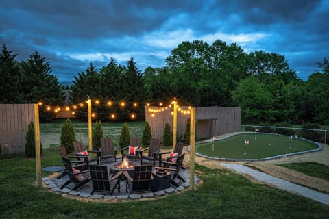 Light up the night by the firepit or enjoy sunny days with a game of putt-putt—your outdoor retreat has it all.